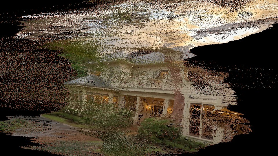 The corrected thirty degree frame with every pixel the facing test withdrew painted in rust red. The withdrawn set follows the right-hand wing of the house and the roof edge; the porch face, still pointed at the camera, comes through untouched